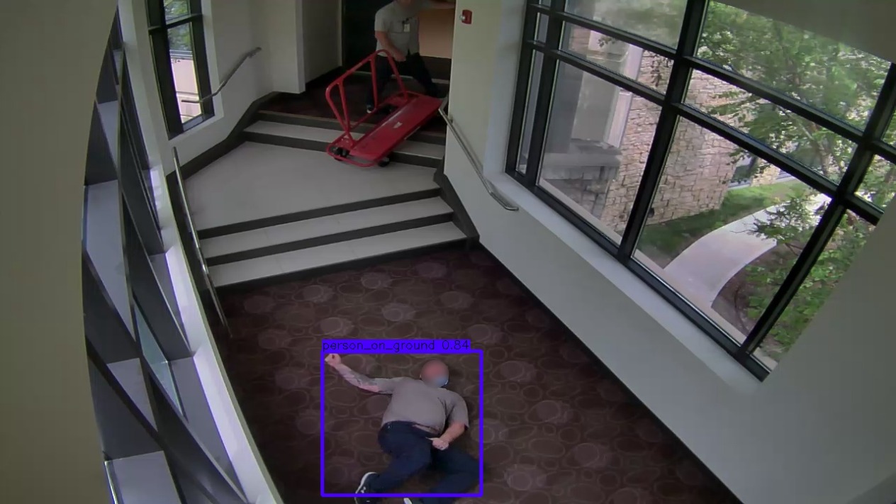 IntelliSee entryway camera capture with a purple detection box around a person on the floor beside a stairway